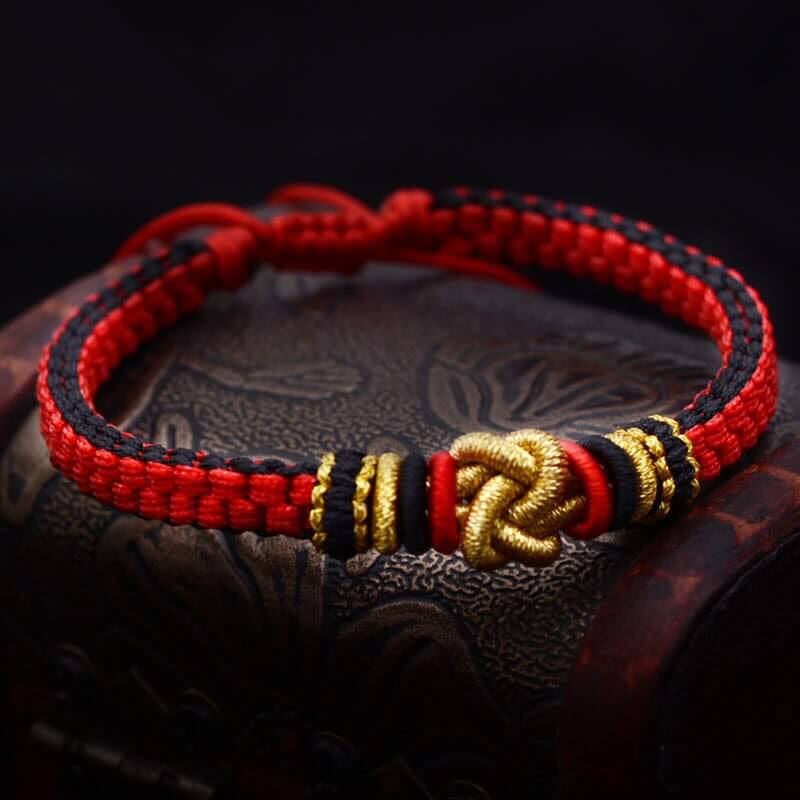 Rot-gold tibetisches Glücksknoten Armband von Spirit Amari Online Shop